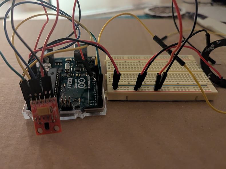 A photo of the APDS 9960 sensor connected via wires with a neoPixel light. Initially I was concerned as I thought I had to solder the sensor. Thankfully, folding over wires made a fine alternative. Making the two work together took some finiking, but eventually I was able to get it sorted. Next steps had me connecting a second neoPixel