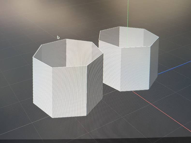 Photo of the 1st iteration of models to act as diffusers. When sliced in Cura, I realized they were larger than anticipated. Reworking them, I added notches at the base for the method of connection to cardboard / wood, preventing glow or tape